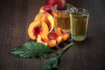 Wall Mural - Still life of fresh peaches and apples on a dark background.