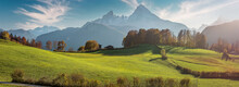 Scenic Image Of European Alps. Panoramic View Of Mountain Scenery In The Alps With Fresh Green Meadows And Majestic Rocky Mount On Background. National Park Berchtesgadener Land, Bavaria, Germany