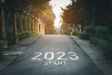 Happy New Year 2023,2023 Symbolizes The Start Of The New Year. The Letter Start New Year 2023 On The Road In The Nature Garden Park Have Tree Environment Ecology Or Greenery Wallpaper Concept.