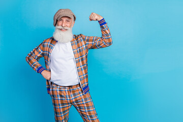 Sticker - Photo of confident charming retired man dressed plaid suit rising fists empty space isolated blue color background