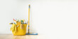 © alexanderon - Brushes, bottles with cleaning liquids, sponges, rag and yellow rubber gloves on white background. Cleaning supplies in the yellow bucket on the wooden floor. Cleaning company service advertisement