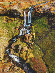 Wall Mural - Vertical photo of Sheep's waterfall in Iceland in autumn