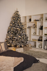 Wall Mural - The room is decorated in a New Year's style with a Christmas tree and toys