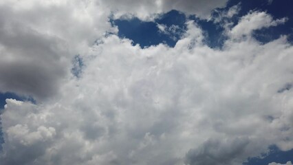 Wall Mural - Blue sky and fluffy clouds timelapse