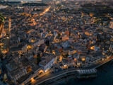 Fototapeta Miasto - Aerial drone view of the citylights of Corfu city at night. Kerkyra. Corfu island. Greece.