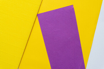 Canvas Print - smooth and corrugated paper background in yellow, purple, and white