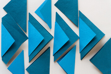 Wall Mural - collection folded blue paper tiles on blank paper