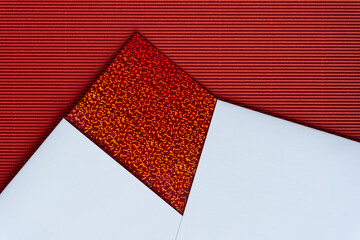 Sticker - rich paper background featuring red glitter paper, white bristol board, and red corrugated paper