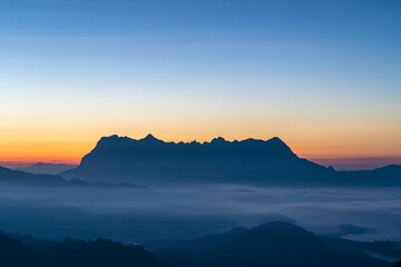 Wall Mural - Majestic view of Doi Luang Chiang Dao in northern Thailand, the third highest mountain in Thailand, seen with beautiful dramatic clouds and colorful sky