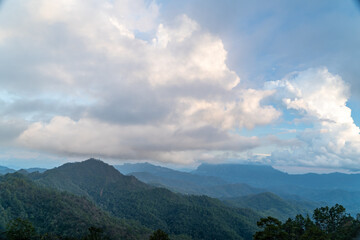 Wall Mural - Majestic view of Doi Luang Chiang Dao in northern Thailand, the third highest mountain in Thailand, seen with beautiful dramatic clouds and colorful sky