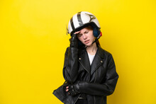 Young English Woman With A Motorcycle Helmet Isolated On Yellow Background With Headache