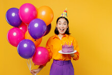 Happy Fun Excited Amazed Young Woman Wears Casual Clothes Hat Celebrating Hold Bunch Of Colorful Air Balloons Cake With Candles Isolated On Plain Yellow Background Birthday 8 14 Holiday Party Concept