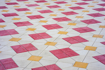 Poster - bright square tiles on the sidewalk, red and white tiles. sidewalk going into the distance