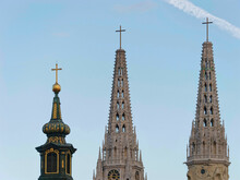 Close-up Photo Of A Tower Of The Church Of St. Mary And Zagreb Cathedral Spires With A Blue Sky In The Background Zagreb, Croatia