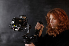 Woman Using A Stabilizer With Camera