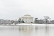 Washington DC in the snow - Jefferson Memorial and snow covered cherry trees at tidal basin - Washington DC United States