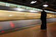 Washington D.C. - Subway station with passengers and train in motion blur	