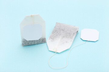 Tea bags on blue background