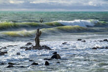 Statue Of Neptune By  An Unknown Author In The Sea Against The Waves, View From The The Pier. Ostia, Lazio, Italy.