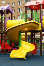 Colourful Slide On Outdoor Playground For Children In Residential Area