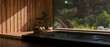 Luxury beautiful Japanese Onsen or jacuzzi against the large glass window with beautiful nature view
