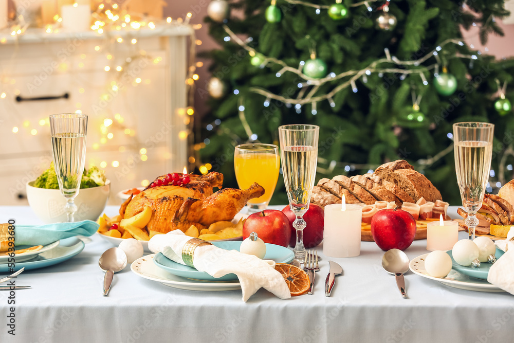 Tasty dishes and drinks for Christmas dinner on table