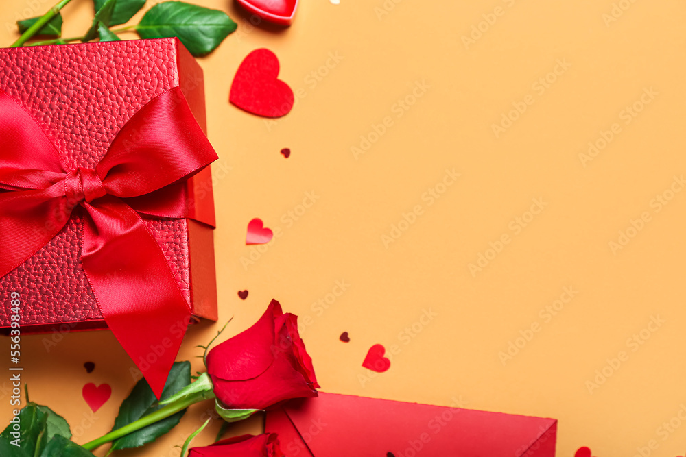 Frame made of gift, rose and hearts on beige background. Valentine's Day celebration