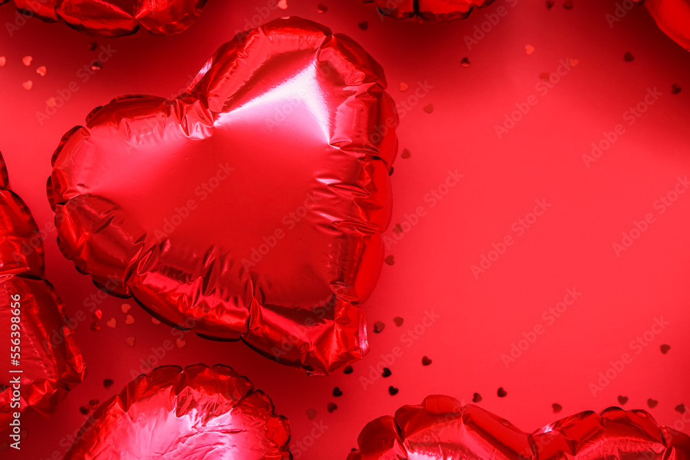 Frame made of heart-shaped balloons on red background. Valentine's Day celebration