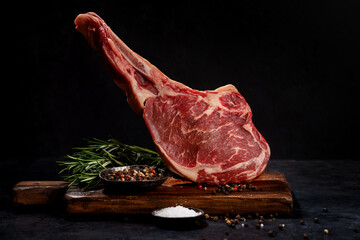 Wall Mural - Raw Tomahawk beef steak and spices