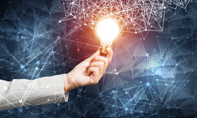 Woman hand with glowing lamp and abstract network