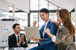 © NINENII - Happy smiling businessman feel happy work complete Teamwork success/success at work in the office concept.