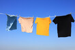 The wind blew clothes that had been dried in the sun and blown under the clear blue summer sky, symbolizing the work of housewives.