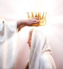 Hands Placing A Crown On A Woman's Head