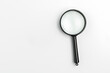 A black lens on a white background. Search Concept