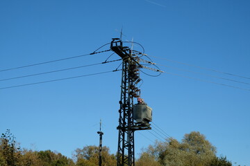 Wall Mural - FU 2021-10-24 WahnGeister 363 Ein Mast mit Stromleitungen ragt in den Himmel