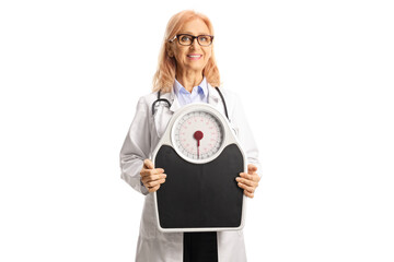 Sticker - Smiling female doctor holding a weight scale