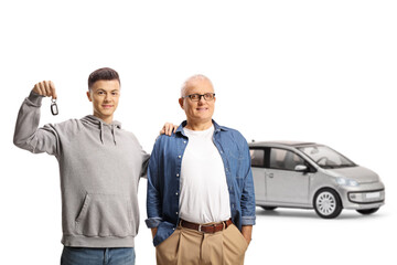 Sticker - Happy father and son showing a key and standing in front of a silver car