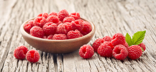 Wall Mural - Raspberry on old wooden background