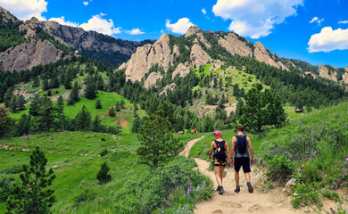 young hiking couple on the ncar trail in boulder, colorado