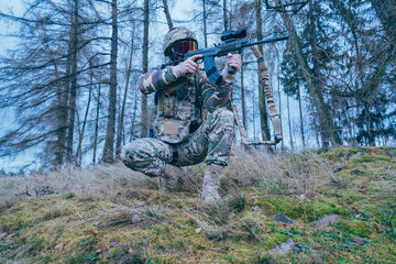 Wall Mural - Member of the International Legion patrols. The war in Ukraine.Army soldier Patrolled the front line. Soldier with assault rifle SA 58