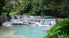 Beautiful Clear Waterfall Cascade In Tropical Rainforest, Kuang Si Falls In Luang Prabang, Laos
