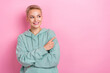 © deagreez - Photo of young positive cheerful cute lady looking interested point finger empty space new winter gifts shop ad isolated on pink color background