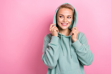 Photo of lovely smile young blonde short hair lady wear her stylish cozy khaki hood pullover look brand mockup ad isolated on pink color background
