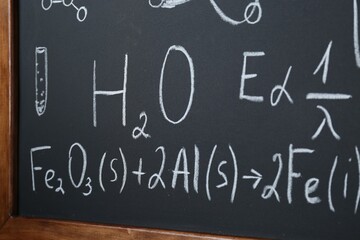 Wall Mural - Different mathematical formulas written with chalk on blackboard, closeup