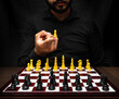 © Narayan - latin man with beard challenging in chess game, chess concept