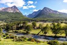 The Andes Mountains Of Patagonia Near Ushuaia Argentina Near The Entrance To Tierra Del Fuego National Park With Horses Roaming The Valley Meadow Along The Clear Creek