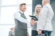 © yurolaitsalbert - close up. business people confirming the deal with a handshake