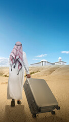 Wall Mural - Rear view of an Arab man wearing keffiyeh and agal walking with a suitcase for traveling in the desert