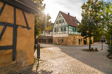 Germany, Bavaria, Forchheim, Empty Cobblestone Street In Old Town At Sunset