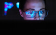 © Westend61 - Engineer designing AI technology with reflection on eyeglasses